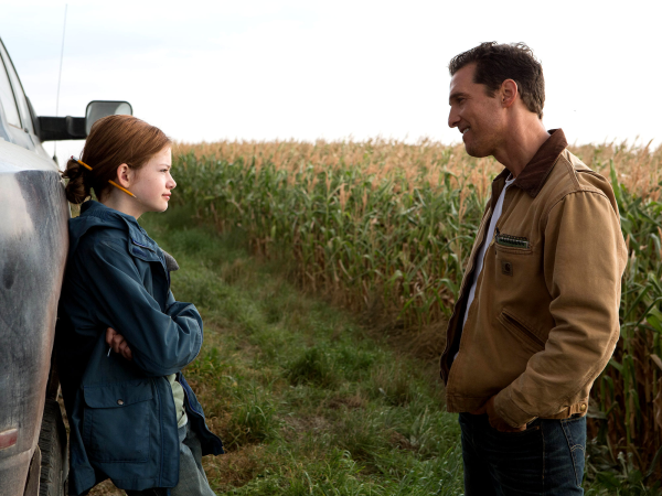 Cooper (Matthew McConaughey) on Earth with his daughter, Murphy (Mackenzie Foy), before he embarks on a mission to provide her with a livable future.
