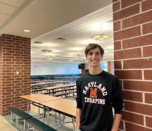 Luke Nelson, pictured in the DHS cafeteria, where he ran his AP Research experiment on the effectiveness of recycling initiatives.