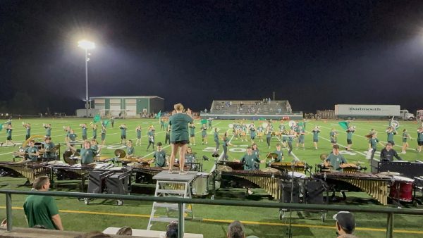 The 2024 DHS Fall Marching Band at an early football game performance at Dartmouth Memorial Stadium.