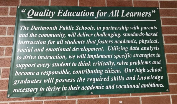 The mission statement of Dartmouth Public Schools is printed on a banner in DHS's main hallway.