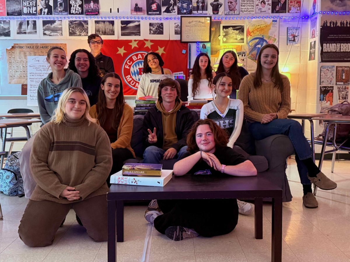 The Spectrum Staff on the couch with this year's DHS exchange students.